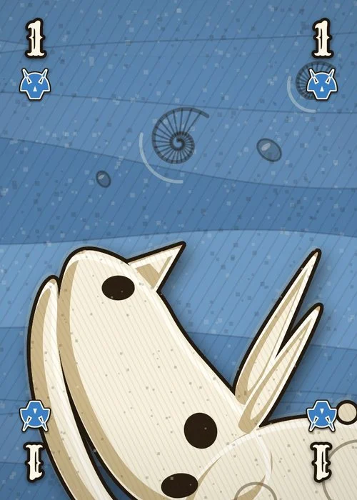 The Triceratops 1 card: blue slate with the beak and horns, a 1 and a blue horned-frill symbol in each corner.